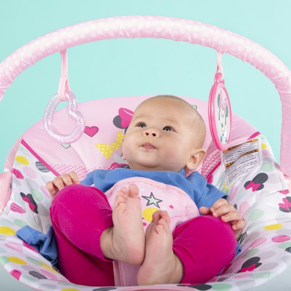 Bright Starts, Disney Baby, Minnie Mouse Spotty Dotty, Babywippe mit Vibrationen, maschinenwaschbarem Sitzpolster, rutschfesten Füßen und 2 Spielzeugen, ab 0 monate