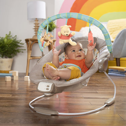 Bright Starts, Disney Baby, Winnie the Pooh Babywippe Babyschaukel mit Vibrationen, Automatischer Ausschaltfunktion, Melodien, Lautstärkeregler, Abnehmbarer Kopfstütze und Spielbogen