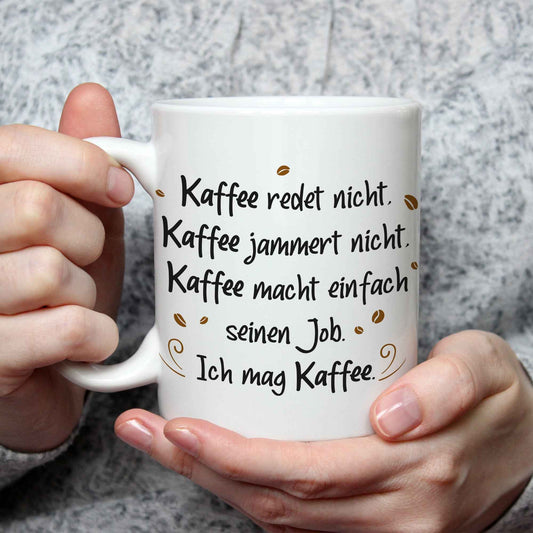 Bedruckte Tasse mit Spruch Kaffee redet nicht