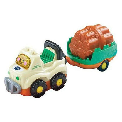 Creamfarbener vtech tut tut fahrzeug spielauto mit licht zieht einen teal anhänger mit orangenem holzstamm