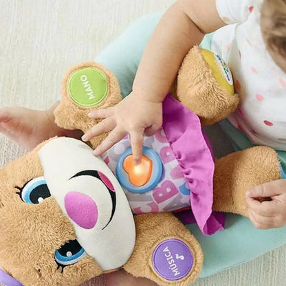 Ein musikalisches plüschtier von mattel rosa mit weißen gesicht, blauen augen, rosa nase und interaktiven tasten