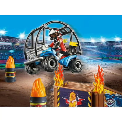 Playmobil 70820 playset zeigt blaue und schwarze monstertruck mit fahrer in roter ausrüstung auf hindernisparcours